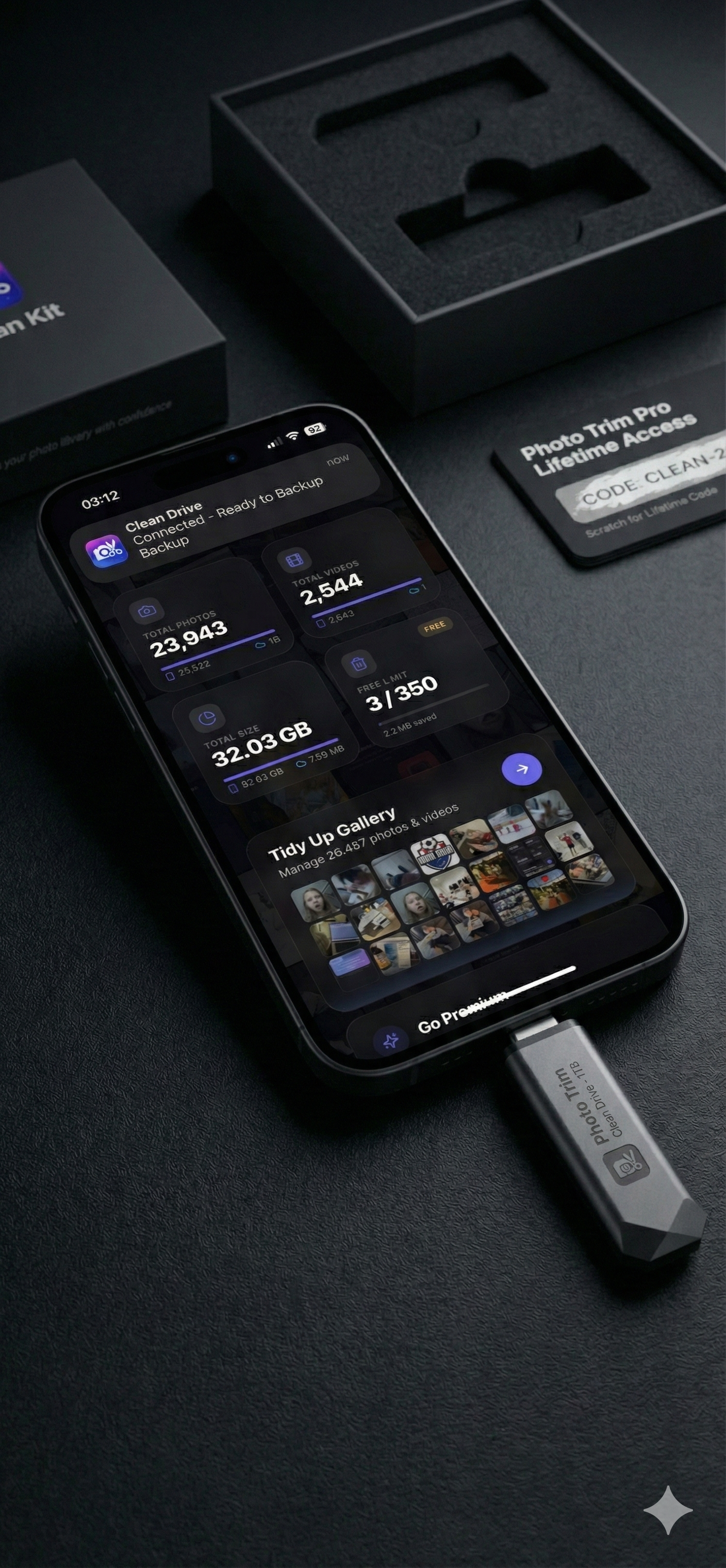 USB drive plugged into iPhone with Photo Trim Kit box